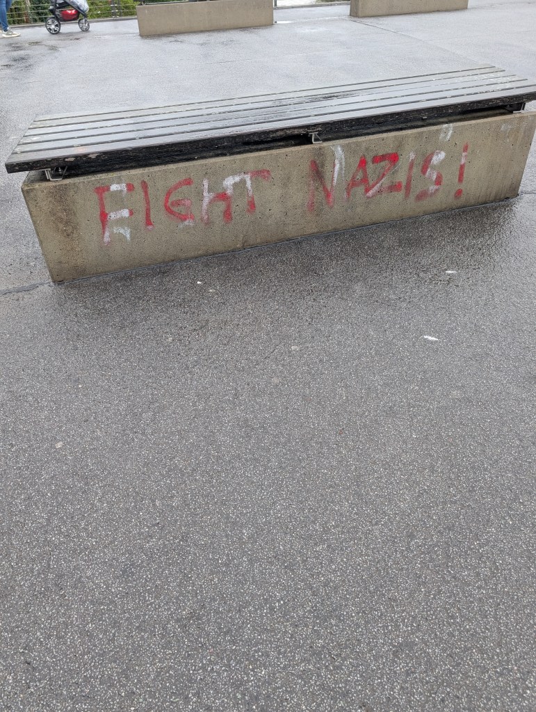 Graffiti on a bench on the chain bridge in Bamberg, Germany, that reads "Fight Nazis"
